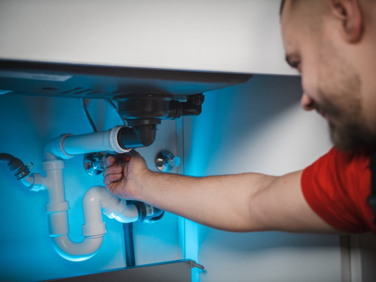 Plumber preparing a home sink repair